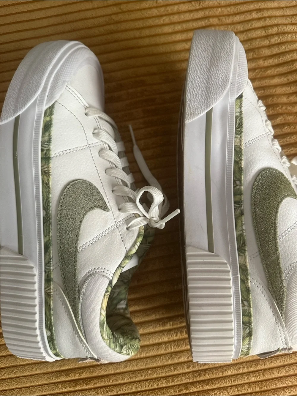 Nike Women's White Sneakers with Olive Swoosh and Leaf-Print Collar